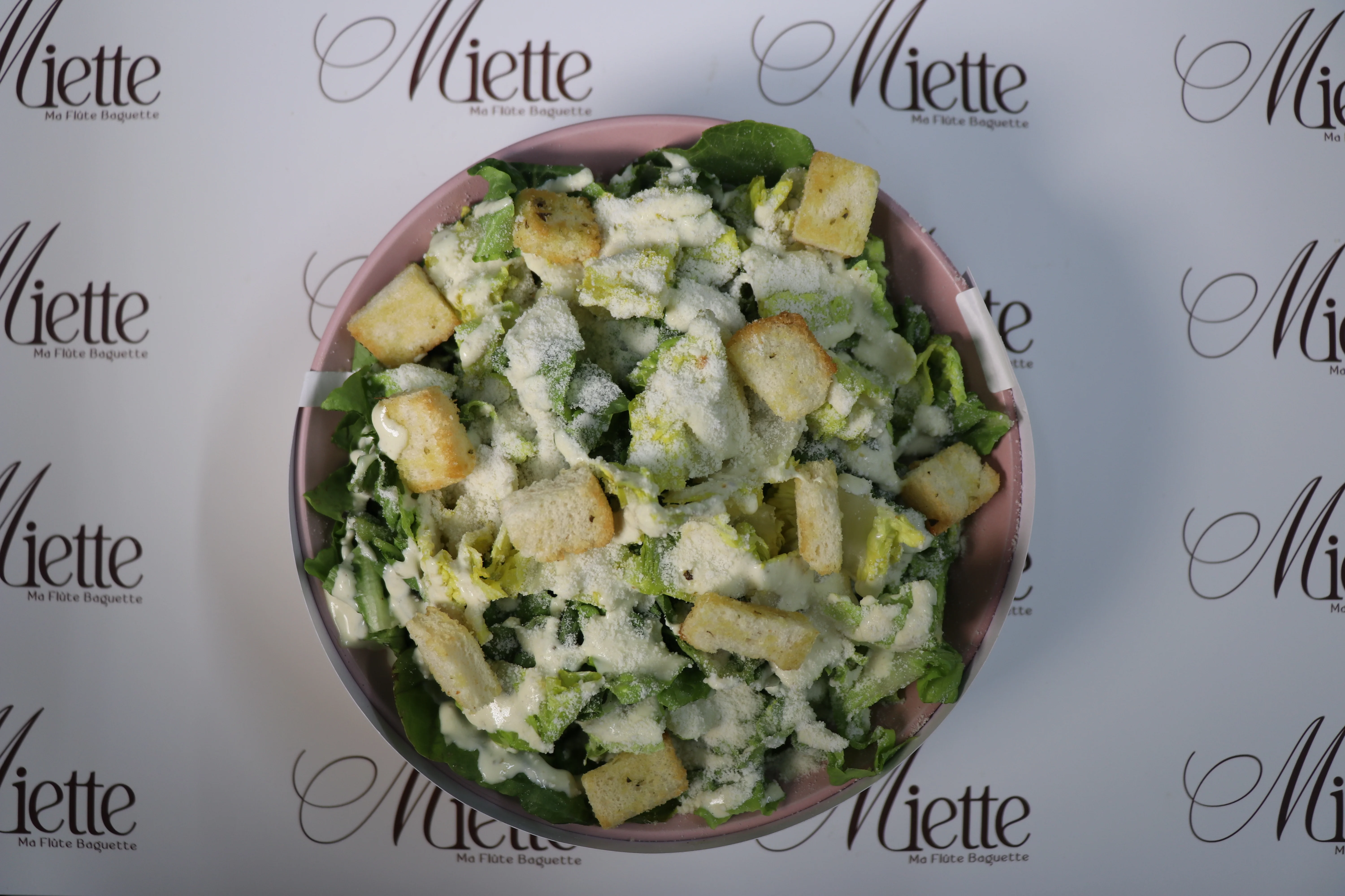 Miette's signature protein bowl with fresh seasonal vegetables and artisan dressing